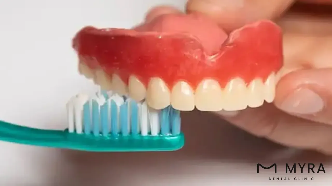 Clean the denture surface thoroughly